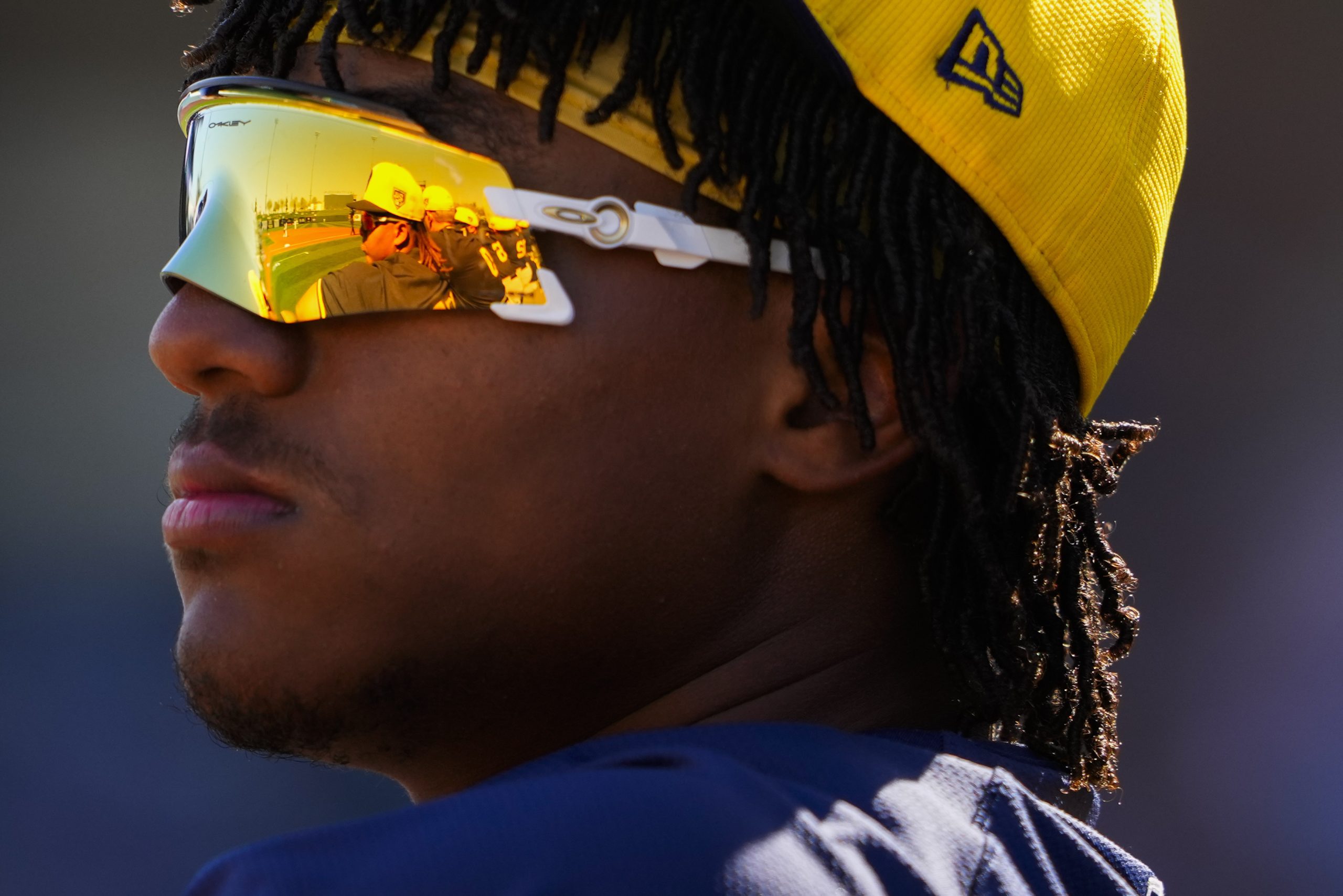 Yophery Rodriguez stands at the dugout
