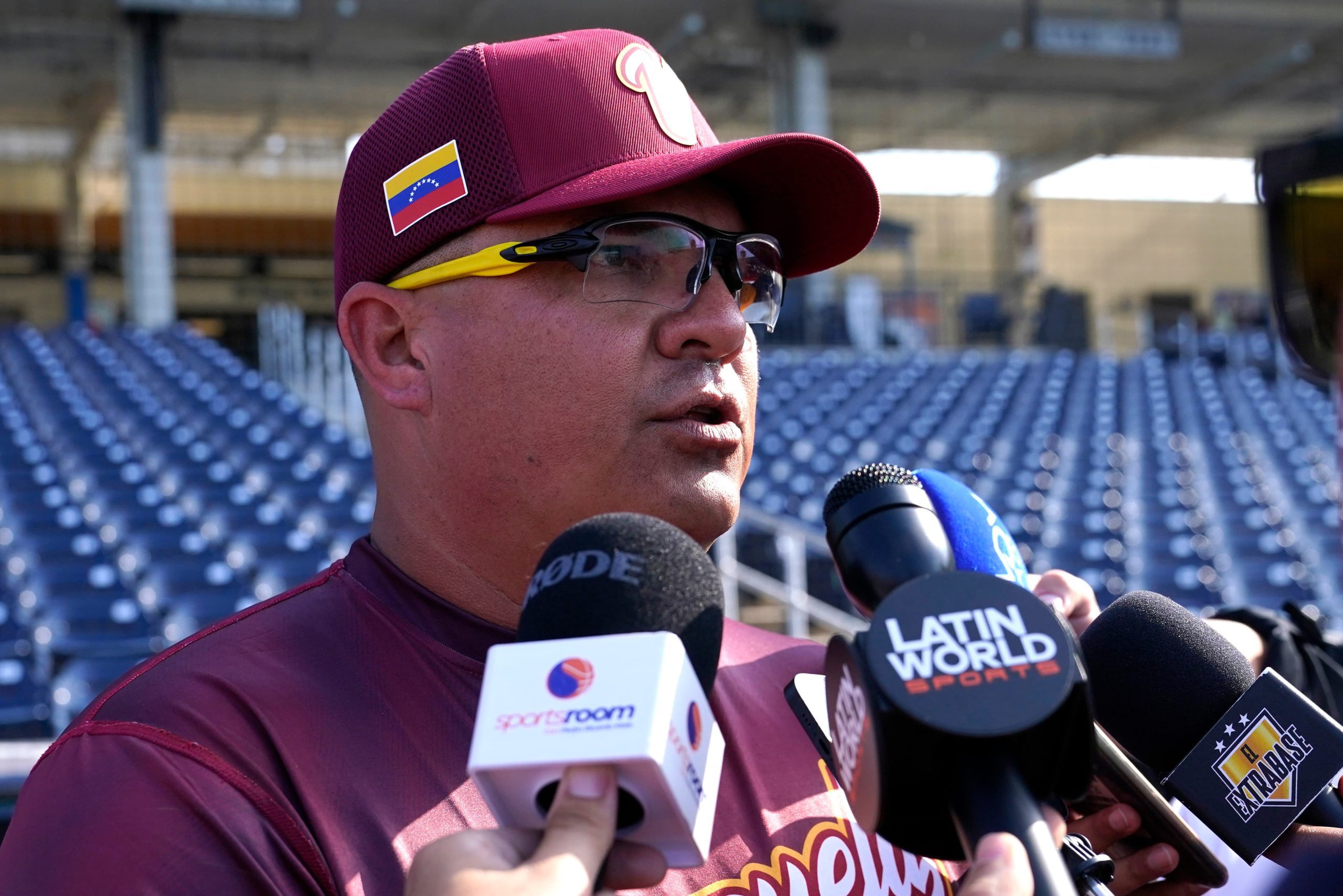 Venezuela Astros Baseball Image ID : 23067798430185 Venezuela manager Omar Lopez talks with the news media during batting practice before an exhibition baseball game against the Houston Astros, Wednesday, March 8, 2023, in West Palm Beach, Fla.