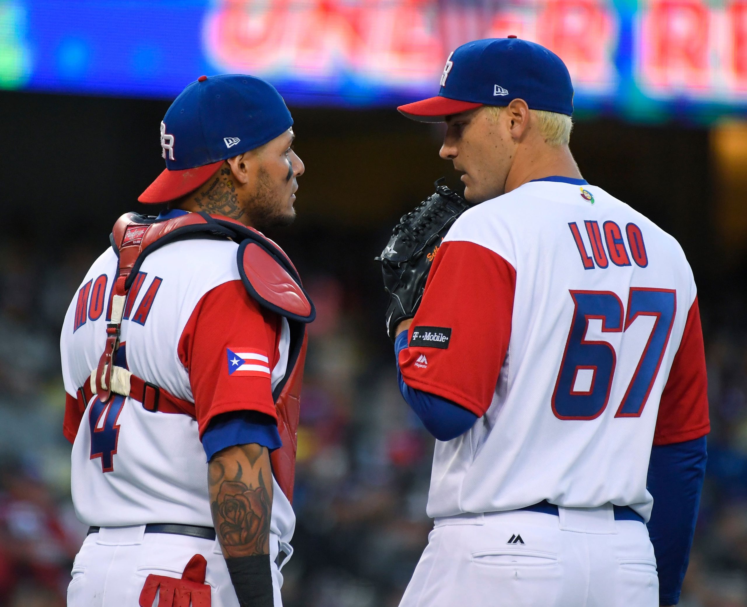 Puerto Rico catcher Yadier Molina, left, talks with pitcher Seth Lugo during the second inning against the United States in the final of the World Baseball Classic. in Los Angeles, Wednesday, March 22, 2017.