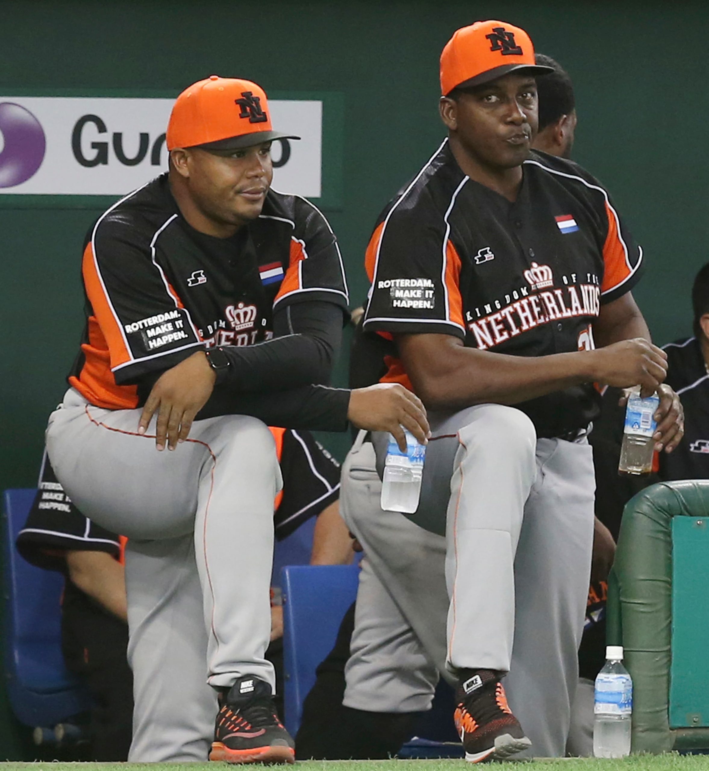 Netherlands' manager Hensley Meulens, right, and coach Andruw Jones watch the mound during an international exhibition series baseball game against Japan at Tokyo Dome in Tokyo, Saturday, Nov. 12, 2016.
