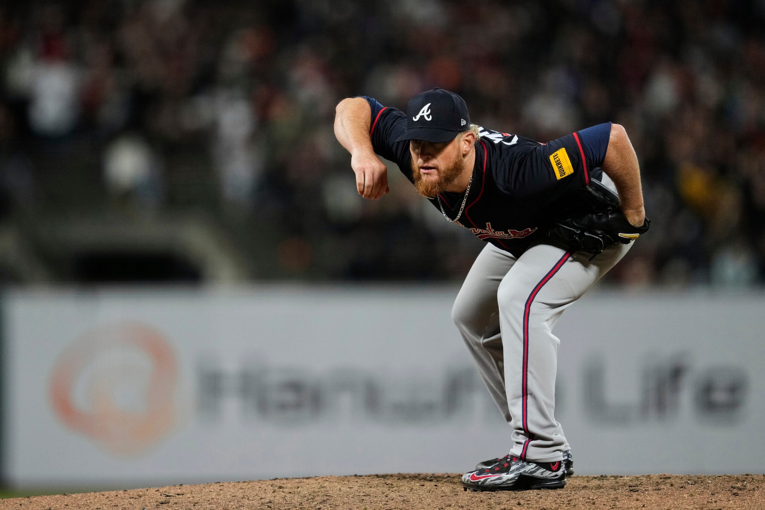 Atlanta Braves pitcher Craig Kimbrel crouches on the mound between pitches during the seventh inning of a baseball game against the San Francisco Giants, Friday, June 6, 2025, in San Francisco.
