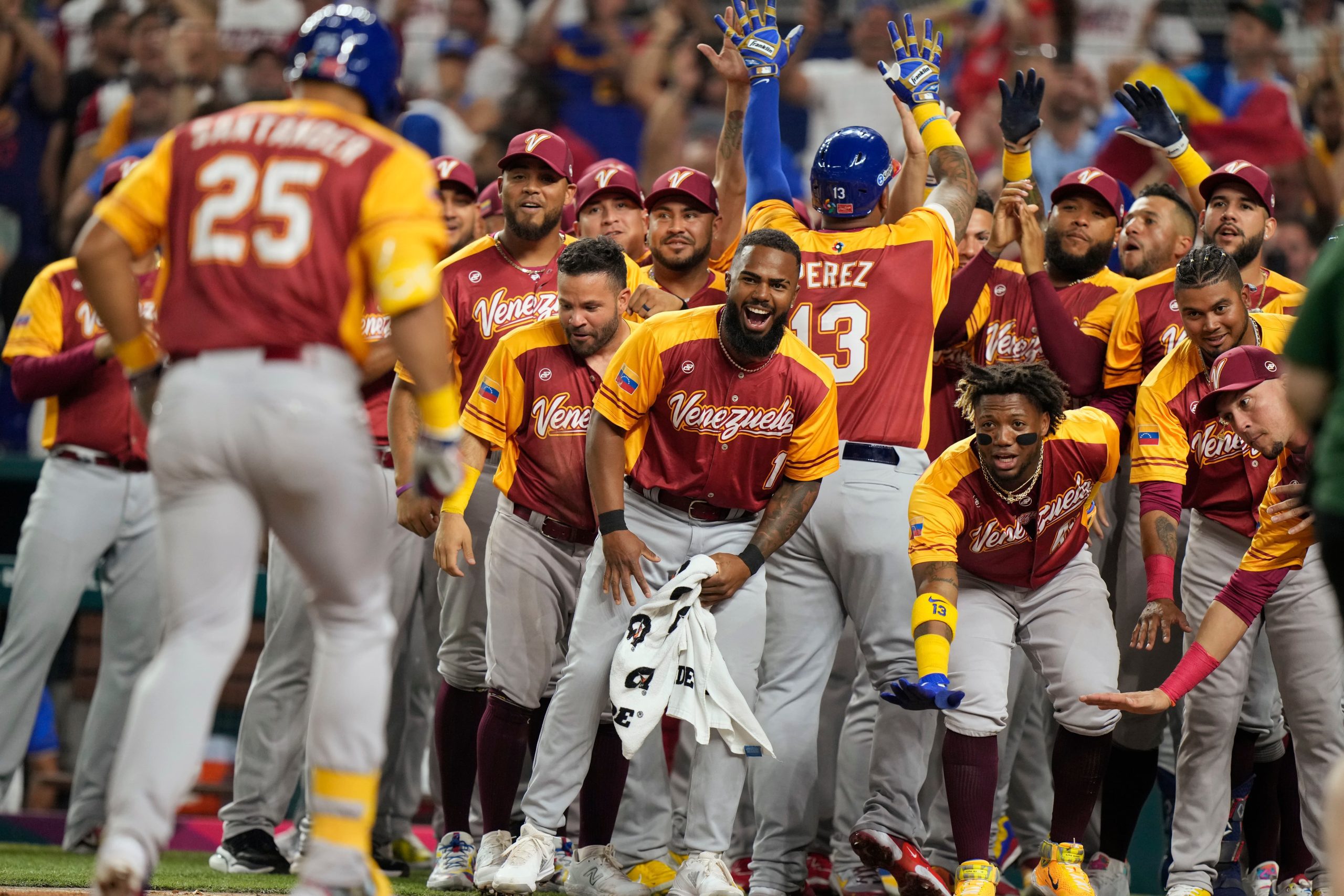 WBC Baseball Venezuela Puerto Rico Baseball Image ID : 23072009183423 Teammates cheer on Venezuela's Anthony Santander (25) as he heads home after hitting a home run scoring Ronald Acuna Jr., and Salvador Perez during the first inning of a World Baseball Classic game against Puerto Rico, Sunday, March 12, 2023, in Miami. (AP Photo/Wilfredo Lee)