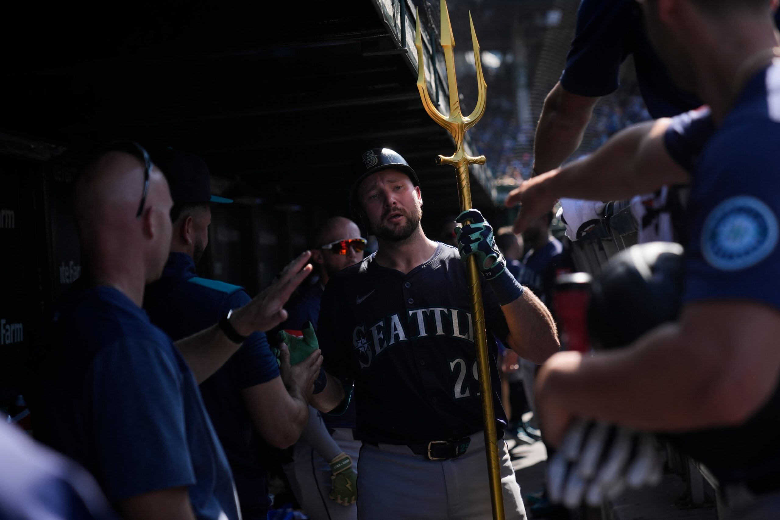 Seattle Mariners' Cal Raleigh, center, celebrates after hitting a home run during the ninth inning of a baseball game against the Chicago Cubs, Saturday, June 21, 2025