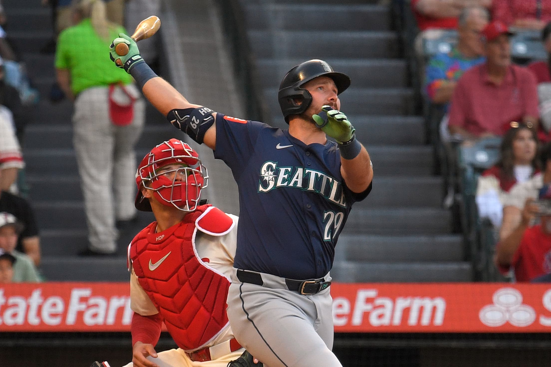 Seattle Mariners' Cal Raleigh, right, hits a two-run home run