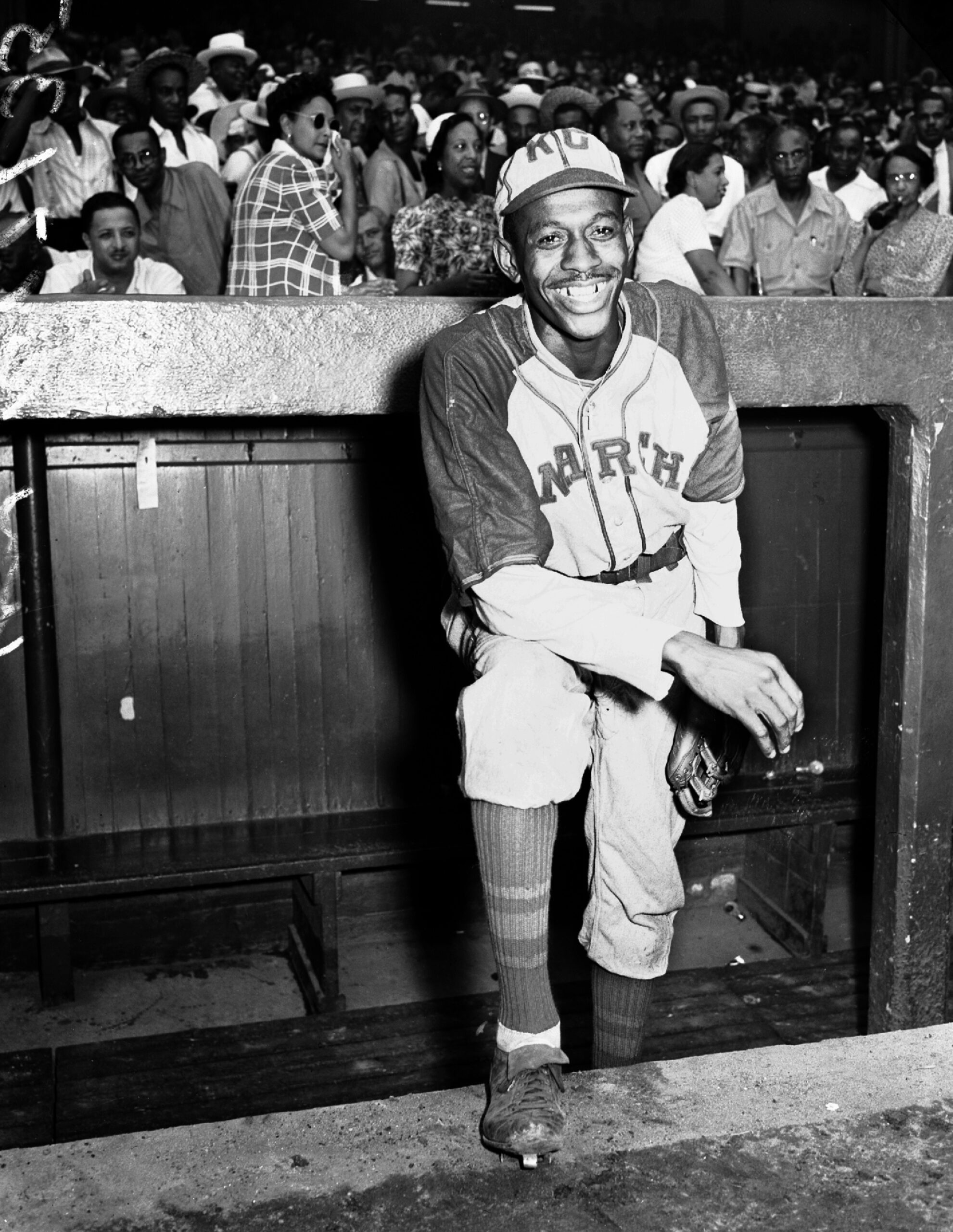 : Kansas City Monarchs pitching great Leroy Satchel Paige poses in the dugout at New York's Yankee Stadium August 2, 1942 for a Negro League game