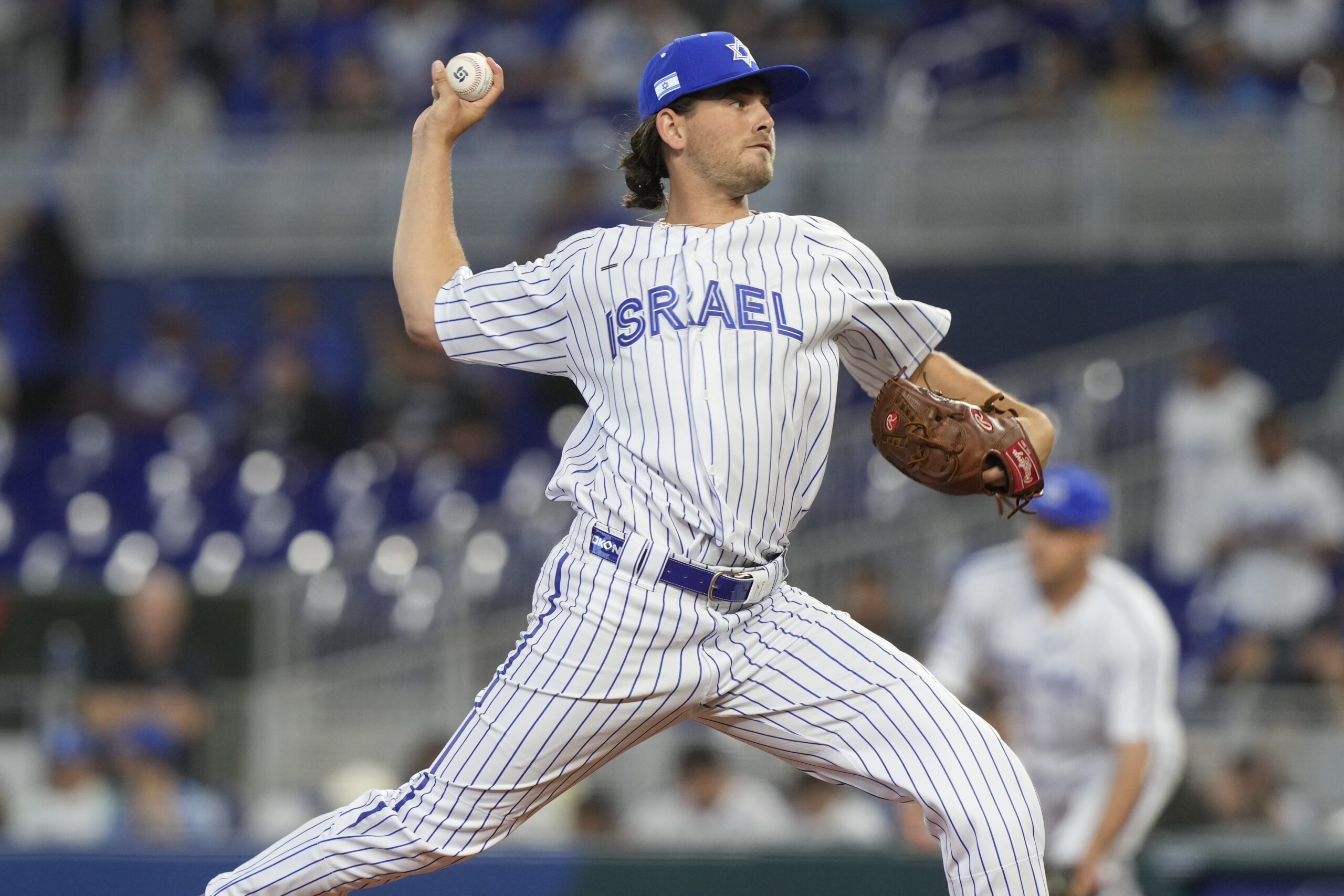 Dean Kremer (17) aims a pitch during the first inning of a World Baseball Classic game against Nicaragua, Sunday, March 12, 2023, in Miami. (AP Photo/Marta Lavandier)