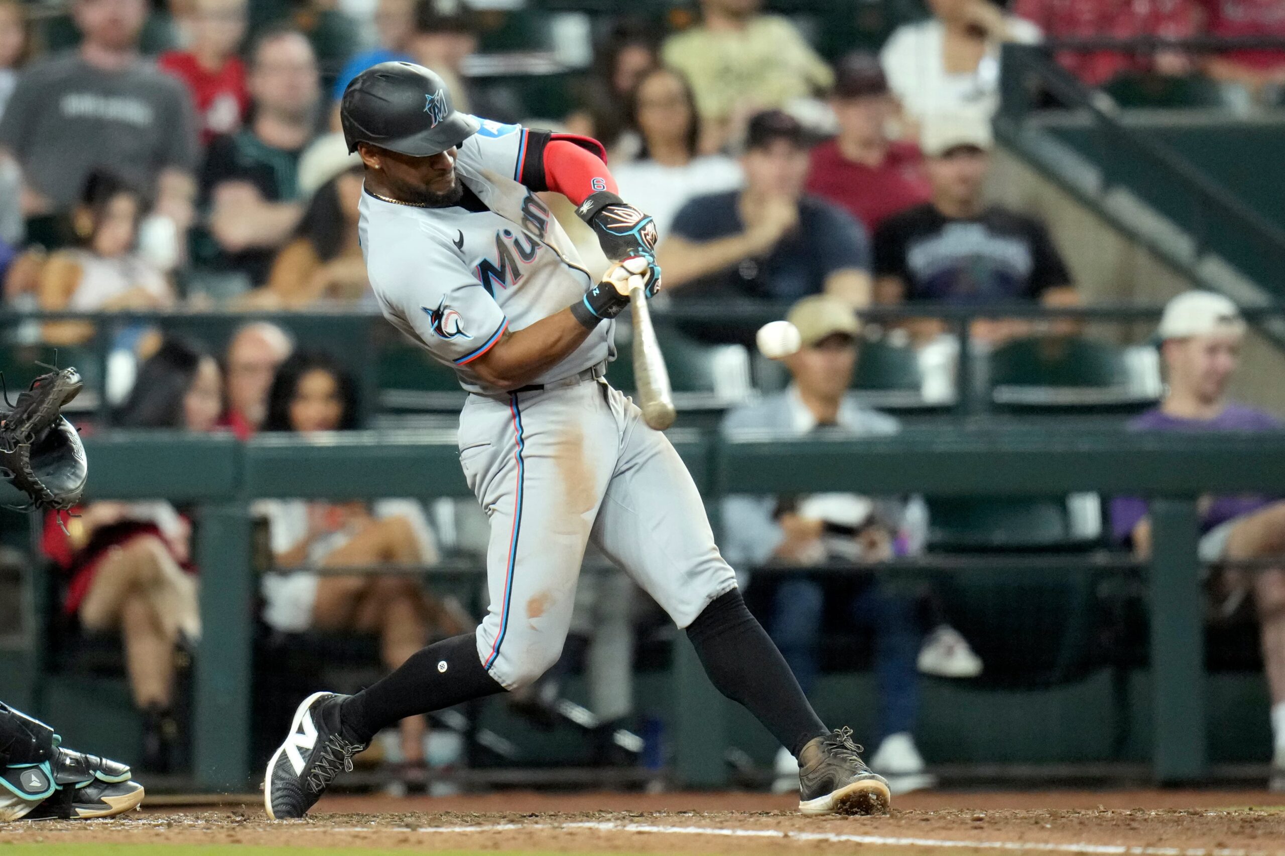 Title: Marlins Diamondbacks Baseball Image ID: 25181005808715 Article: Miami Marlins' Otto Lopez connects for a two-run single against the Arizona Diamondbacks during the eighth inning of a baseball game Sunday, June 29, 2025, in Phoenix. (AP Photo/Ross D. Franklin)