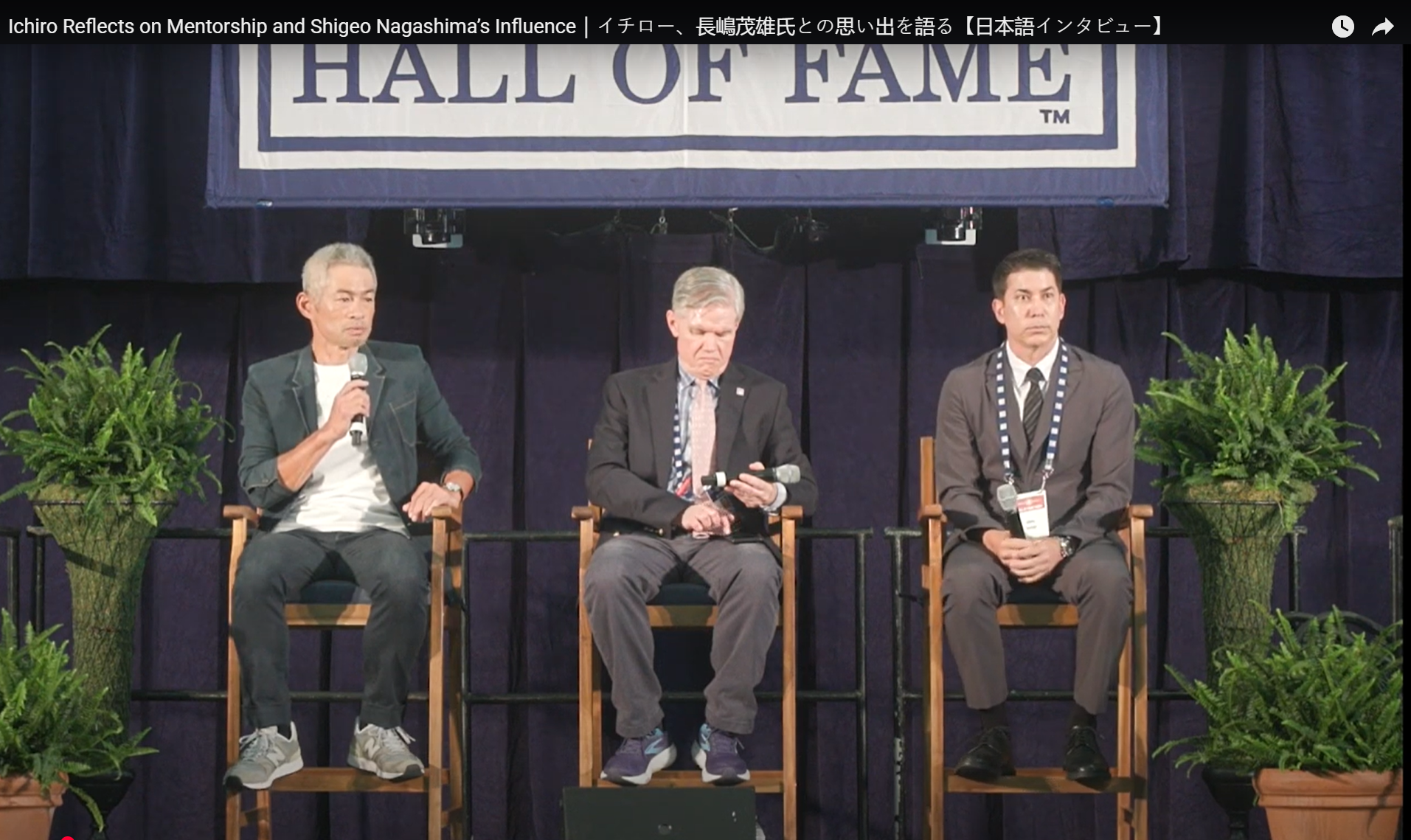 Ichiro Suzuki speaks during Hall of Fame Weekend media availability in Cooperstown, wearing a dark green zip jacket and sneakers
