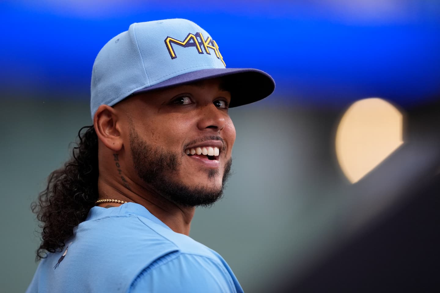Title: Rockies Brewers Baseball Image ID: 25181213191002 Article: Milwaukee Brewers' Freddy Peralta smiles from the dugout during a baseball game against the Colorado Rockies, Friday, June 27, 2025, in Milwaukee. (AP Photo/Aaron Gash)