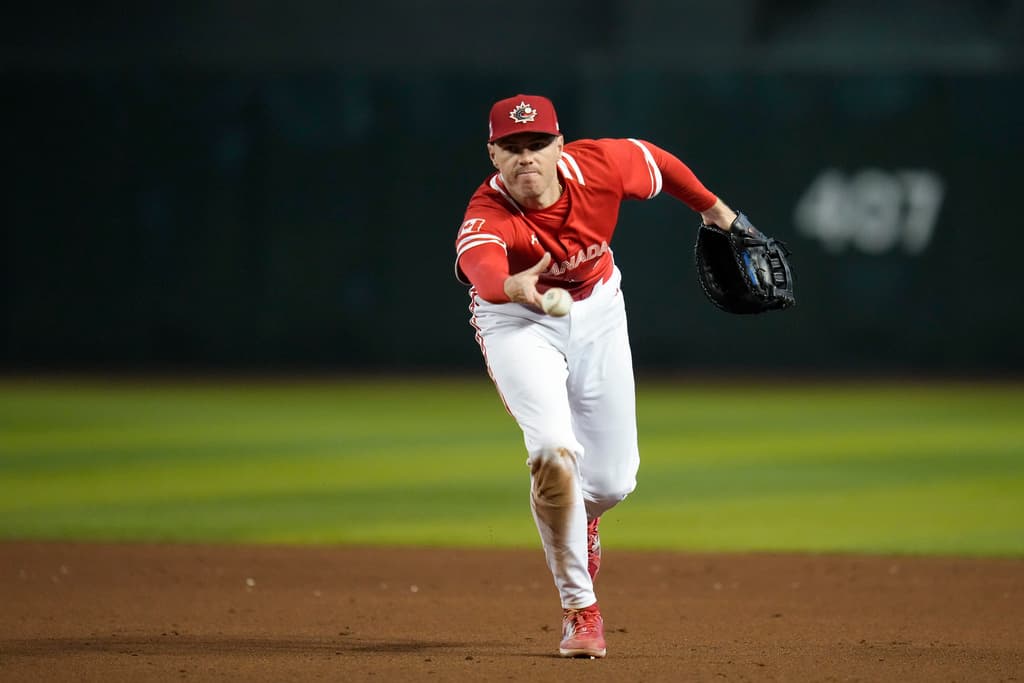 Title: WBC Baseball Great Britain Canada Image ID: 23071826681271 Article: Canada first baseman Freddie Freeman throws to first for an out against Great Britain during the sixth inning of a World Baseball Classic game in Phoenix, Sunday, March 12, 2023. (AP Photo/Godofredo A. Vásquez)