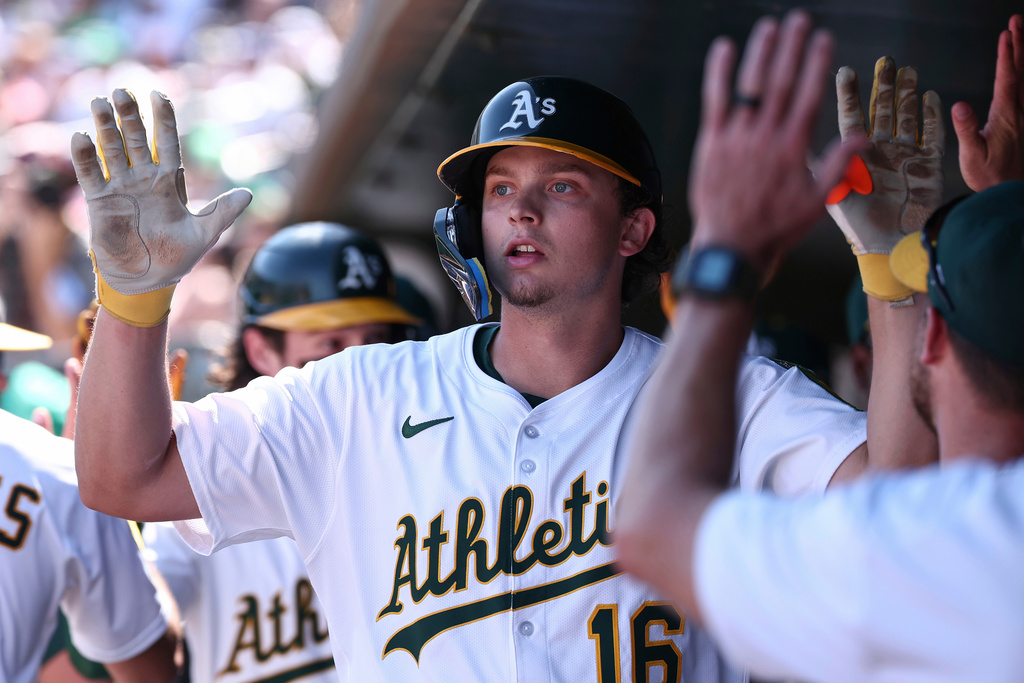 Title: Reds Athletics Baseball Image ID: 25257777259446 Article: Athletics' Nick Kurtz celebrates in the dugout after hitting a two-run home run during the fifth inning of a baseball game against the Cincinnati Reds, Sunday, Sept. 14, 2025, in West Sacramento, Calif. (AP Photo/Sara Nevis)