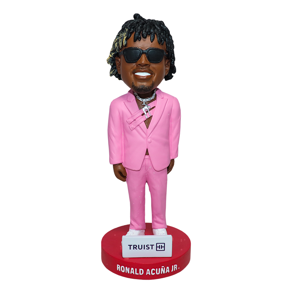 Ronald Acuña Jr. Red Carpet Bobblehead wearing pink suit, diamond chains, and sunglasses — a Truist Park giveaway honoring his iconic MLB Awards look.