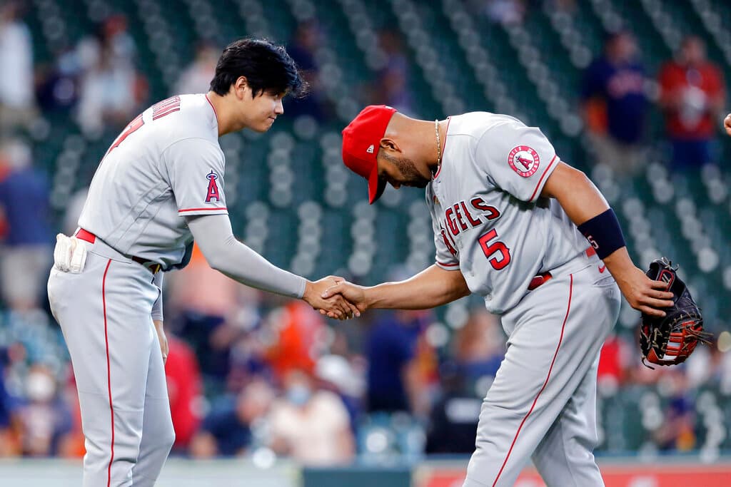 Title: Angels Astros Baseball Image ID: 21115775745877 Article: Los Angeles Angels' Shohei Ohtani, left, and Albert Pujols (5) shake hands and bow after their 4-2 win over the Houston Astros after a baseball game Sunday, April 25, 2021, in Houston. (AP Photo/Michael Wyke)