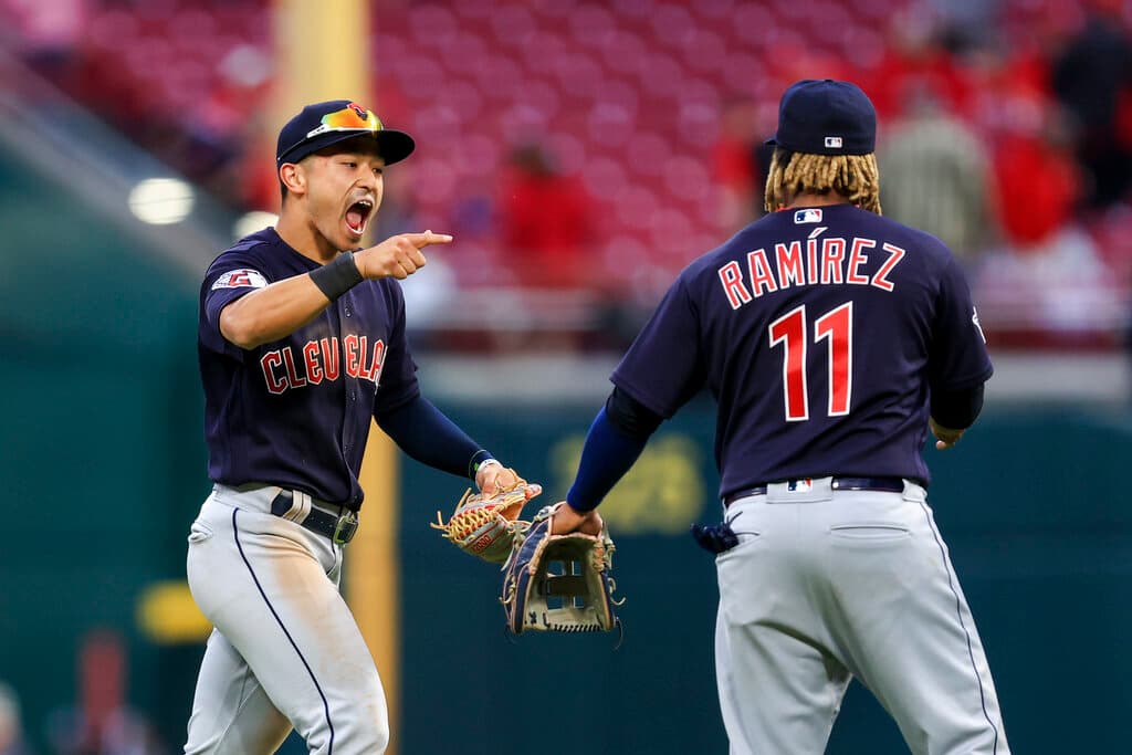 Title: Guardians Reds BaseballImage ID: 22102859943621 Article: Cleveland Guardians' Andres Gimenez, left, points as he yells to celebrate with Jose Ramirez after the final out of a baseball game against the Cincinnati Reds in Cincinnati, Tuesday, April 12, 2022. (AP Photo/Aaron Doster) 