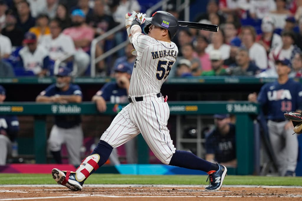 Japan's Munetaka Murakami (55) hits a home run during the second inning a World Baseball Classic game against the U.S., Tuesday, March 21, 2023, in Miami. (AP Photo/Marta Lavandier)
