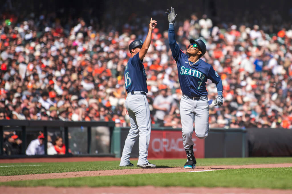 Title: Mariners Giants BaseballImage ID: 25094821477174 Article: Seattle Mariners' Jorge Polanco, right, high-fives the third base coach after hitting a home run during the fifth inning of a baseball game against the San Francisco Giants in San Francisco, Friday, April 4, 2025. (AP Photo/Nic Coury) 
