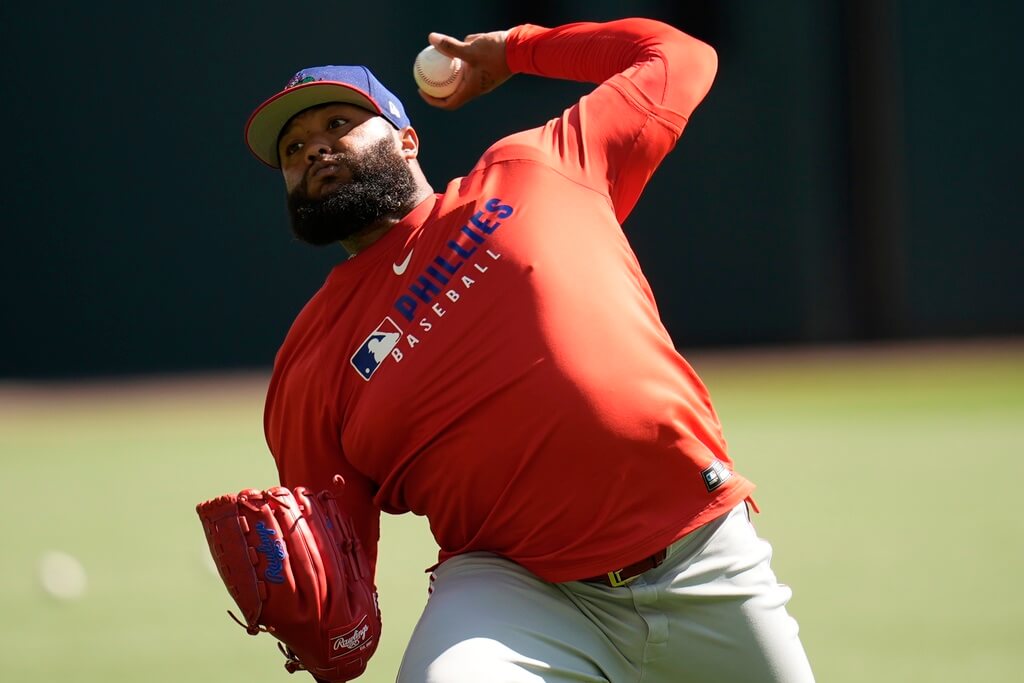 Philadelphia Phillies pitcher José Alvarado warms up before a baseball game against the Atlanta Braves, Wednesday, April 9, 2025, in Atlanta. (AP Photo/Mike Stewart)
