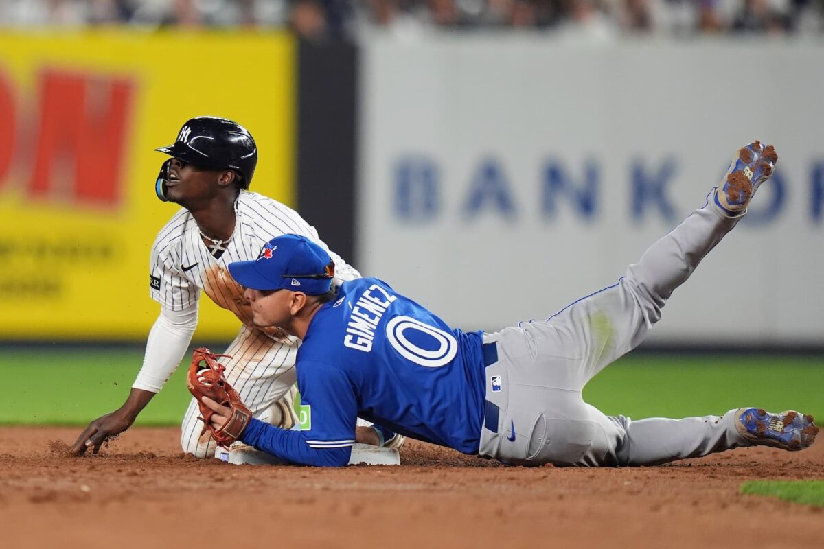 Title: Blue Jays Yankees Baseball Image ID: 25116032727445 Article: Toronto Blue Jays' Andrés Giménez, right, tags out New York Yankees' Jazz Chisholm Jr. after Chisolm Jr. attempted to steal second base during the sixth inning of a baseball game, Friday, April 25, 2025, in New York. (AP Photo/Frank Franklin II)