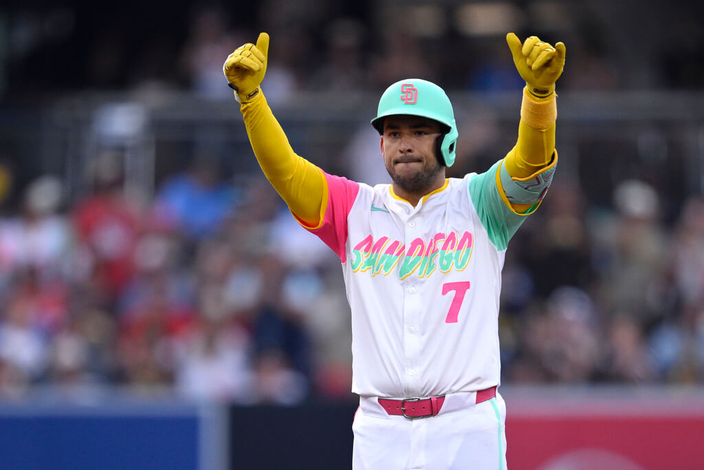 San Diego Padres' Jose Iglesias celebrates after hitting an RBI double during the second inning of a baseball game against the Philadelphia Phillies, Friday, July 11, 2025, in San Diego. (AP Photo/Orlando Ramirez)