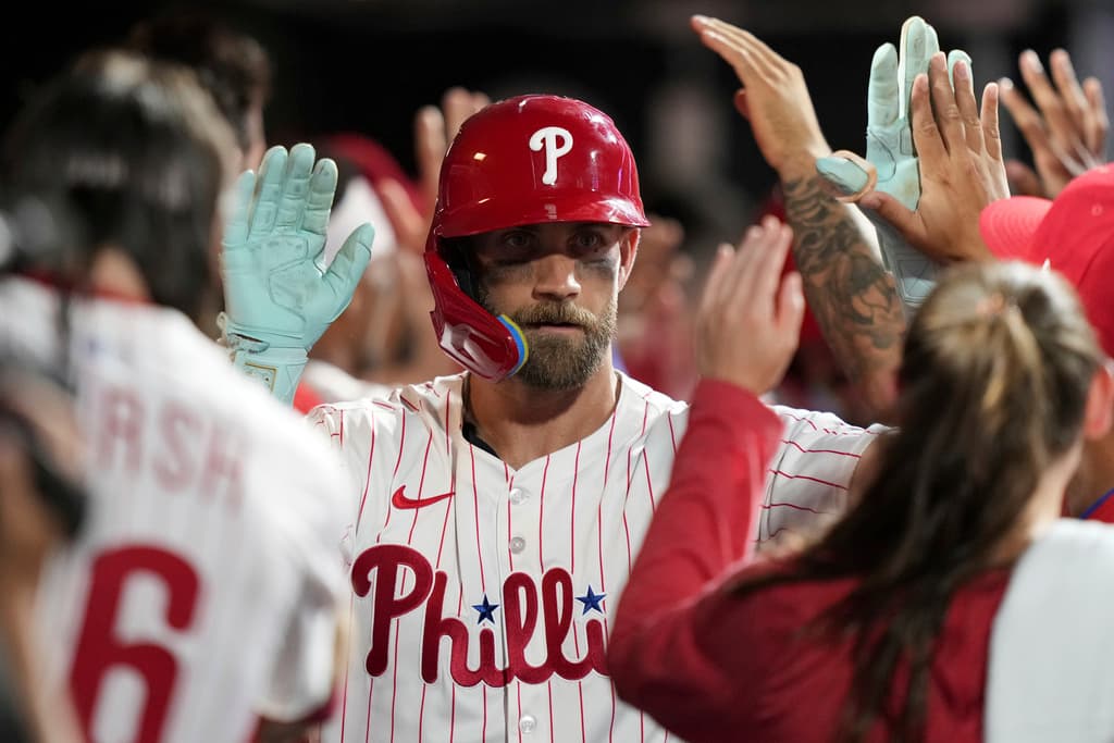 Title: Angels Phillies BaseballImage ID: 25201041542796 Article: Philadelphia Phillies' Bryce Harper celebrates in the dugout after hitting a two-run home run during the eighth inning of a baseball game against the Los Angeles Angels Saturday, July 19, 2025, in Philadelphia. (AP Photo/Matt Slocum) 