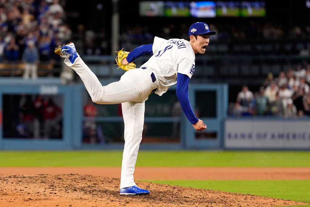 AP25275369075135 2 - World Baseball Network Title: Reds Dodgers BaseballImage ID: 25275369075135 Article: Los Angeles Dodgers relief pitcher Roki Sasaki throws to the plate during the ninth inning in Game 2 of the National League Wild Card baseball playoff series against the Cincinnati Reds, Wednesday, Oct. 1, 2025, in Los Angeles. (AP Photo/Mark J. Terrill)
