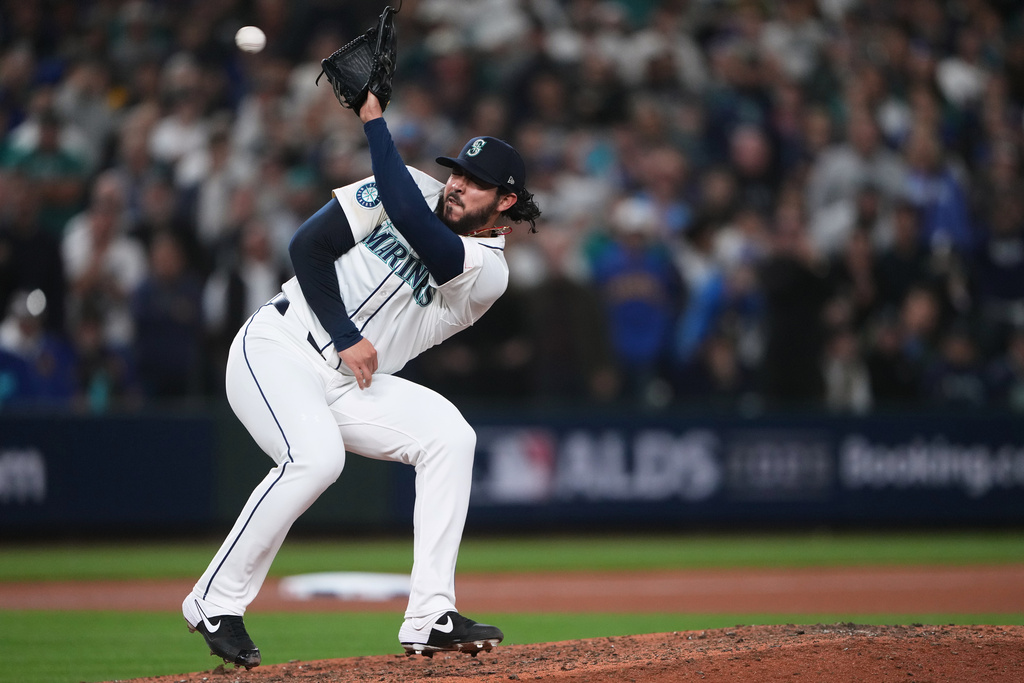 ALDS Tigers Mariners Baseball - World Baseball Network Seattle Mariners closer Andrés Muñoz fields a line drive during the ninth inning against the Detroit Tigers in Game 1 of the 2025 American League Division Series.