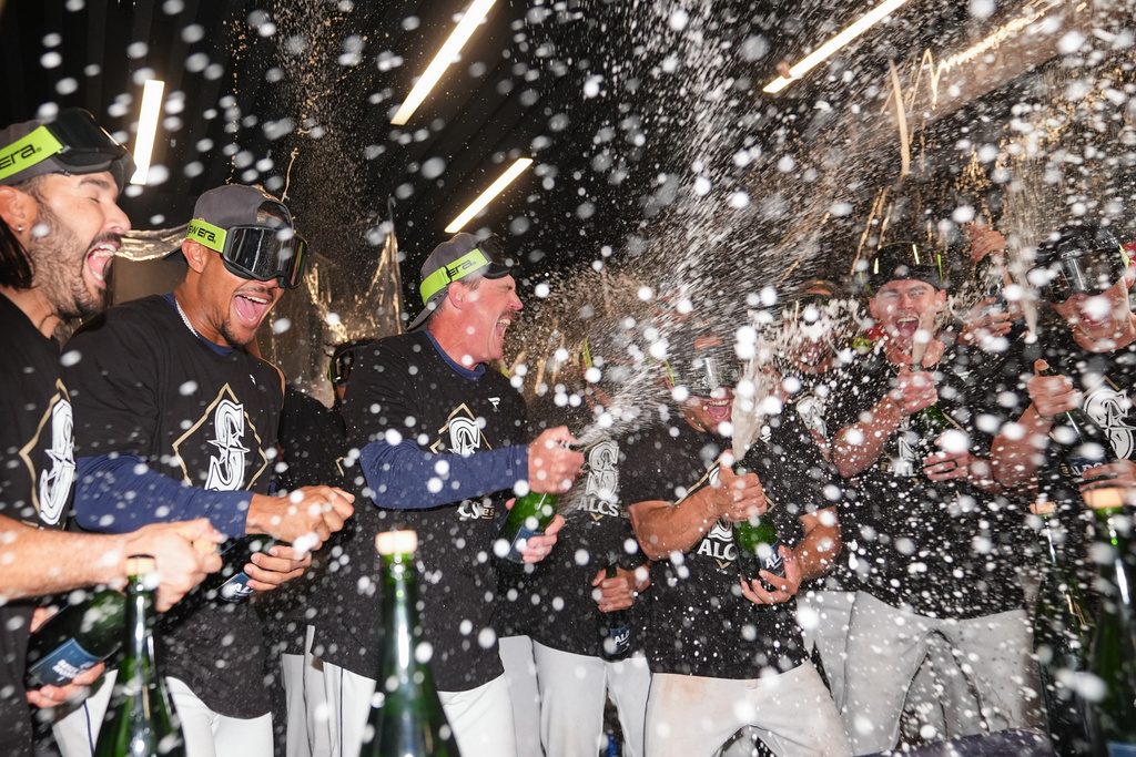 Title: APTOPIX ALDS Tigers Mariners Baseball Image ID: 25284217311916 Article: Seattle Mariners players celebrate after the team's win over the Detroit Tigers in Game 5 of baseball's American League Division Series Friday, Oct. 10, 2025, in Seattle. (AP Photo/Lindsey Wasson)