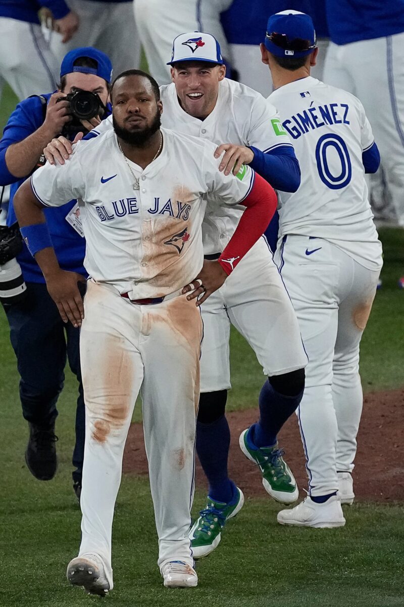 Title: ALCS Mariners Blue Jays Baseball Image ID: 25294115678400 Article: Toronto Blue Jays Vladimir Guerrero Jr., left, and George Springer celebrate after Game 7 of baseball's American League Championship Series against the Seattle Mariners, Monday, Oct. 20, 2025, in Toronto. (AP Photo/David J. Phillip)