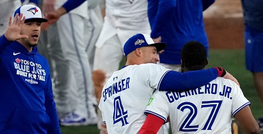 Title: ALCS Mariners Blue Jays BaseballImage ID: 25294123009429 Article: Toronto Blue Jays Vladimir Guerrero Jr. (27) and George Springer (4) celebrate after Game 7 of baseball's American League Championship Series against the Seattle Mariners, Monday, Oct. 20, 2025, in Toronto. (AP Photo/David J. Phillip) 