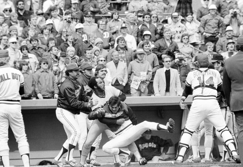 Title: Twins Angels BrawlImage ID: 780422061 Article: An unidentified Minnesota Twins player is pulled down by California Angels Ron Jackson as Jackson and Twins Jose Morales, left, and Geoff Zahn watch the rest of the action in a bench clearing brawl in Bloomington, Minn., April 22, 1978, which was precipitated when Angels Bobby Grich charged Twins pitcher Roger Erickson on a pitch he didn't like. (AP Photo/Jim Mone) 