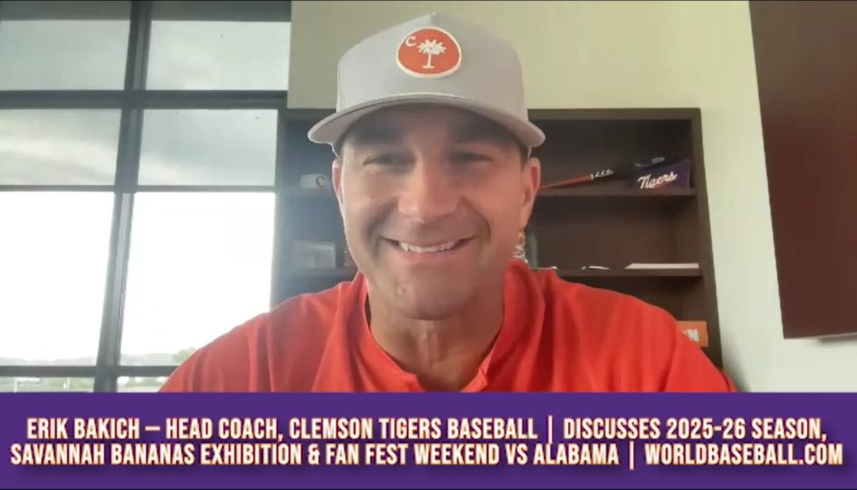 Erik Bakich smiling during a World Baseball Network interview about Clemson Tigers Baseball, Fan Fest weekend, and the Savannah Bananas exhibition game.