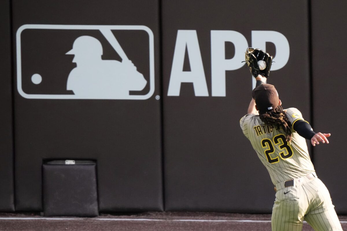 Title: Padres Cubs Baseball Image ID: 25274789147922 Article: San Diego Padres' Fernando Tatis Jr. makes a running catch on a ball hit by Chicago Cubs' Nico Hoerner during the eighth inning of Game 2 of a National League wild card baseball game Wednesday, Oct. 1, 2025, in Chicago. (AP Photo/Nam Huh)