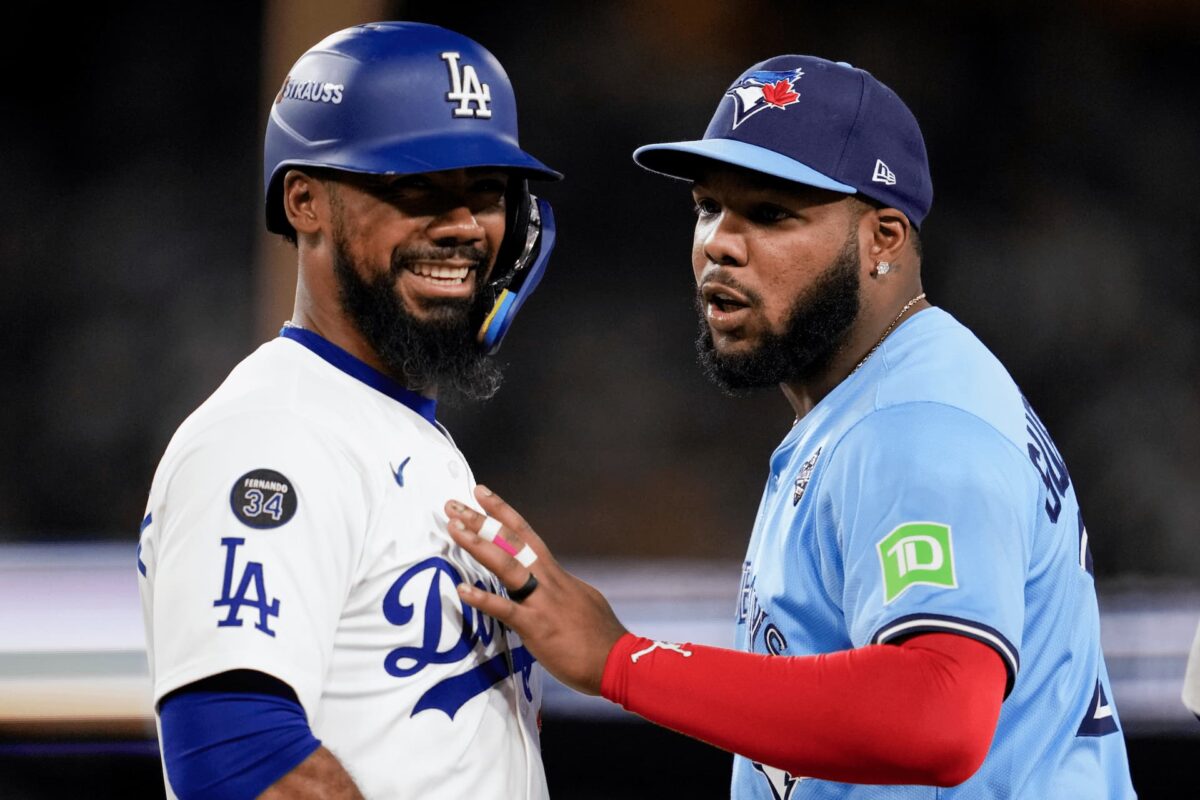 Title: World Series Blue Jays Dodgers Baseball Image ID: 25303057732973 Article: Los Angeles Dodgers' Teoscar Hernández, left, laughs with Toronto Blue Jays' Vladimir Guerrero Jr. after a base hit during the fourth inning in Game 5 of baseball's World Series, Wednesday, Oct. 29, 2025, in Los Angeles. (AP Photo/Ashley Landis)