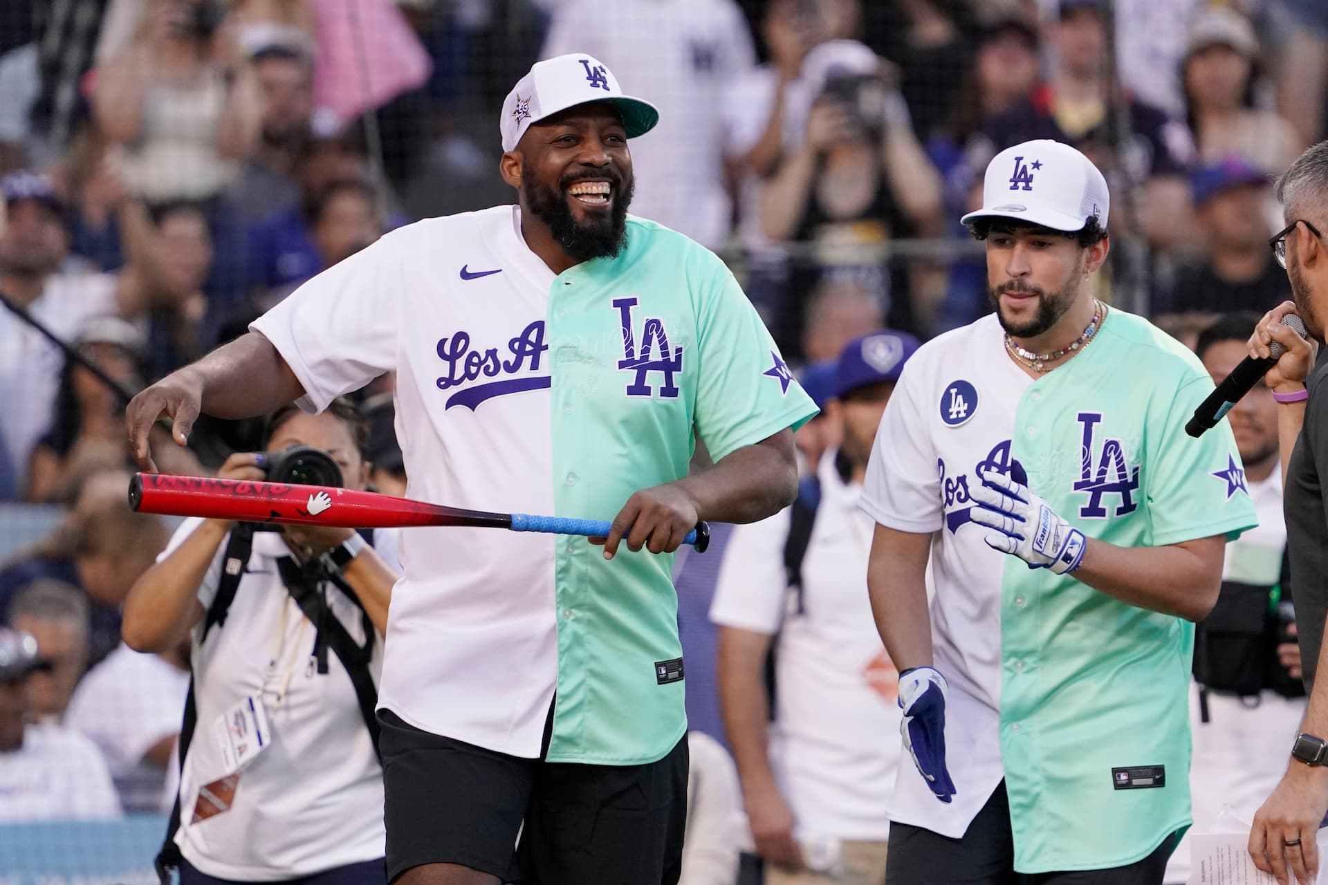 Title: MLB All Star Celebrity Softball Image ID: 22198101097492 Article: Former Major League Baseball player Vladimir Guerrero smiles next to Rapper and Singer Bad Bunny during the MLB All Star Celebrity Softball game, Saturday, July 16, 2022, in Los Angeles. (AP Photo/Mark J. Terrill)