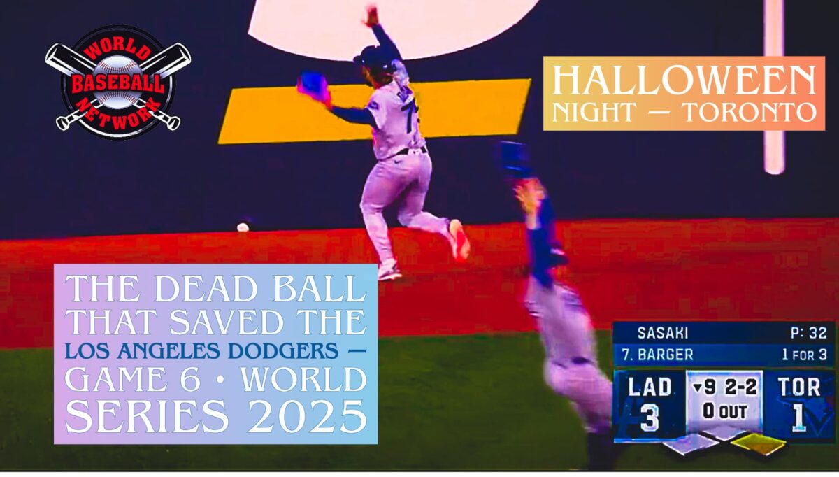 Dodgers center fielder Justin Dean signals for a dead ball after it lodges beneath the outfield wall during Game 6 of the 2025 World Series on Halloween night in Toronto.