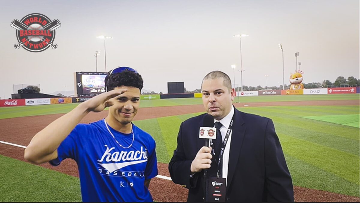World Baseball Network reporter Matthew Tallarini interviews Karachi Monarchs shortstop Isaac Nuñez on the field at BU Ballpark in Dubai during Baseball United’s first full-season debut.
