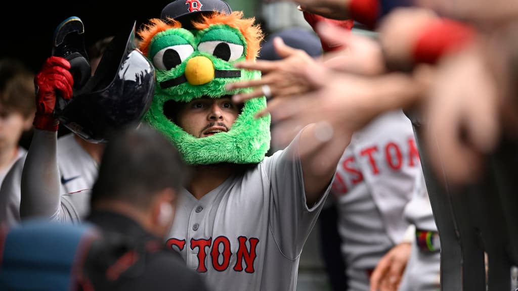 Title: Red Sox Cubs Baseball Image ID: 25201753096839 Article: Boston Red Sox's Wilyer Abreu celebrates with teammates in the dugout while wearing the green monster mask after hitting a solo home run during the eighth inning of a baseball game against the Chicago Cubs, Sunday, July 20, 2025, in Chicago. (AP Photo/Paul Beaty)