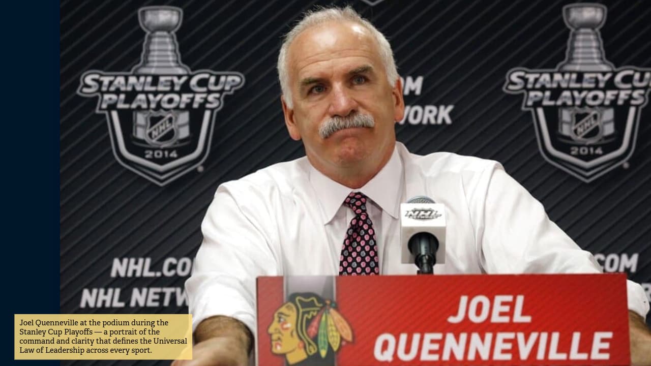 Joel Quenneville at the podium during the Stanley Cup Playoffs — a portrait of the command and clarity that defines the Universal Law of Leadership across every sport.