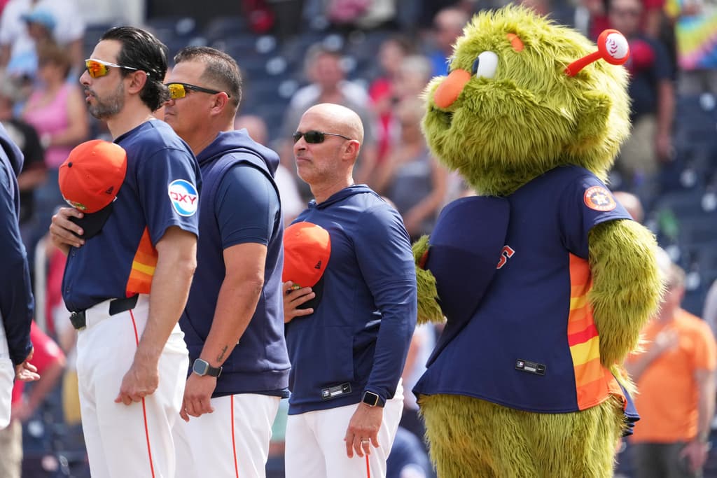 Astros manager Joe Espada standing during national anthem at spring training