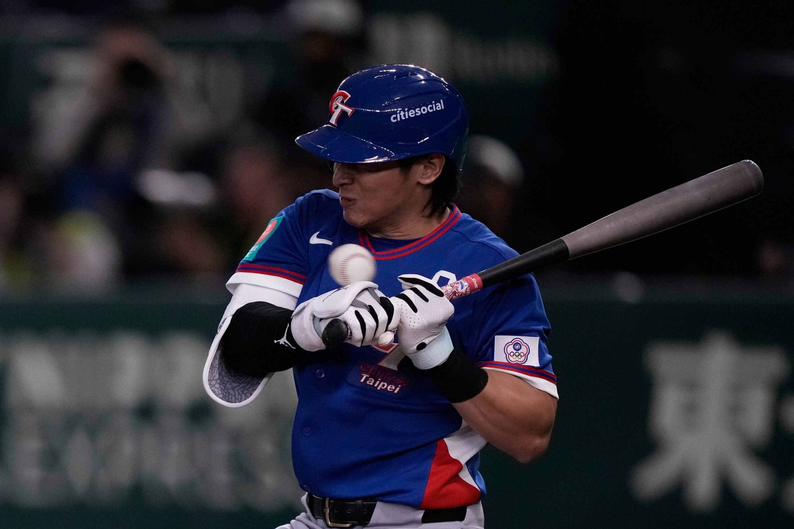 Taiwan's Chen Chieh-hsien is hit by a pitch in the sixth inning of a World Baseball Classic game in Tokyo, Thursday, March 5, 2026. (AP Photo/Louise Delmotte)