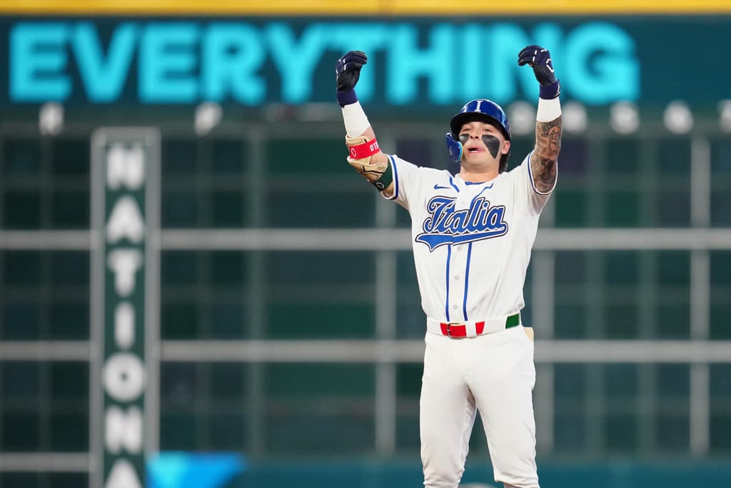 Title: WBC Puerto Rico Italy Baseball Image ID: 26073759580449 Article: Italy's Andrew Fischer celebrates after hitting a two-run double during the fourth inning of a World Baseball Classic quarterfinal game against Puerto Rico, Saturday, March 14, 2026, in Houston. (AP Photo/Karen Warren)