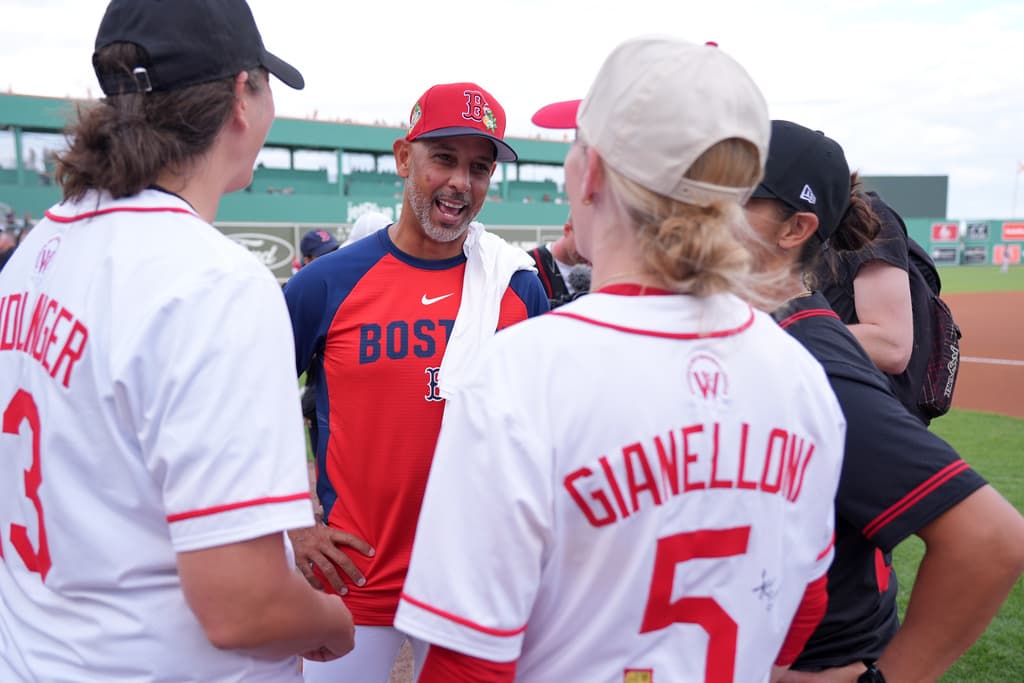 Red Sox manager Alex Cora speaking with women's baseball players in Fort Myers