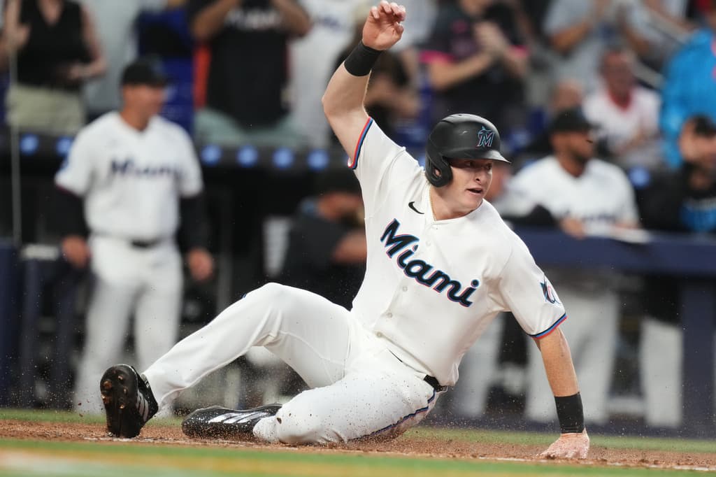 Miami Marlins outfielder Owen Caissie scores during the second inning on an RBI single by Javier Sanoja against the Colorado Rockies on Opening Day