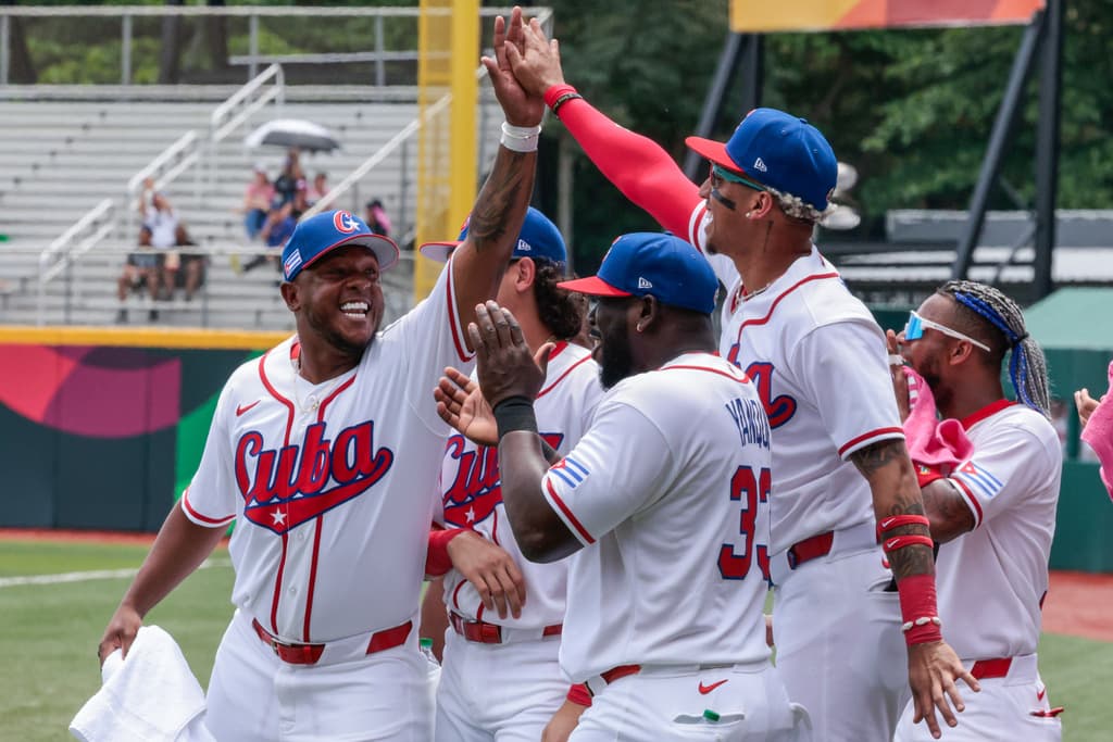 Cuba’s Ariel Martínez celebrates with Roel Santos after hitting a two-run home run against Colombia during a World Baseball Classic game in San Juan on March 8, 2026.