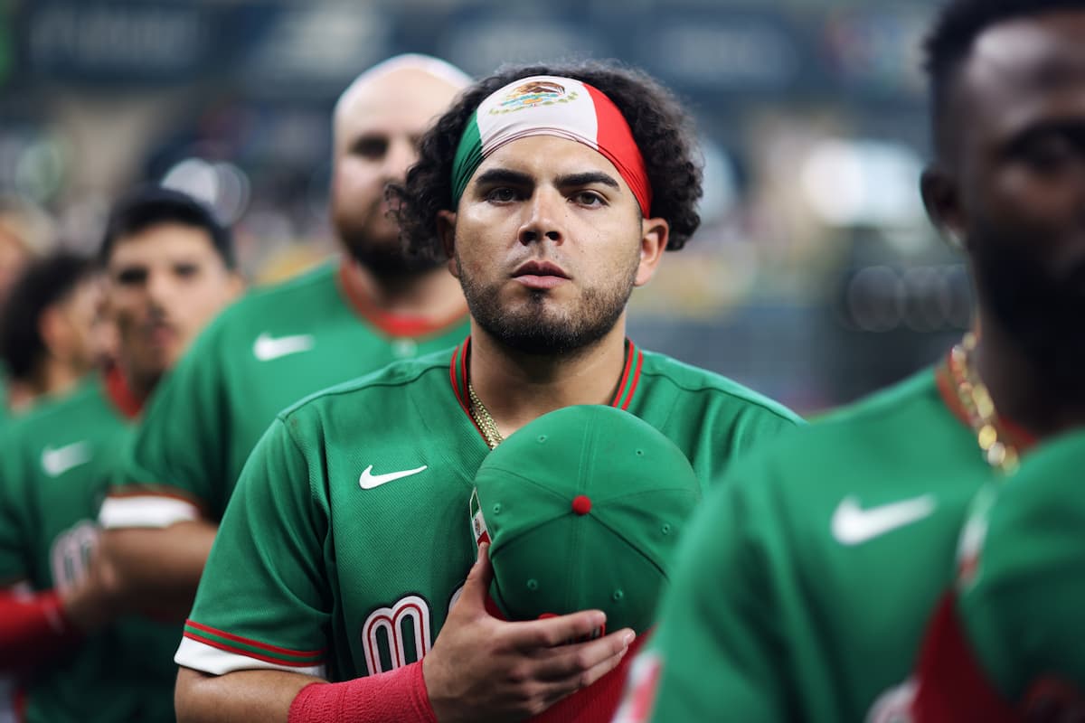 Mexico players stand during the national anthem before a Pool B game against Great Britain at the 2026 World Baseball Classic at Daikin Park in Houston.