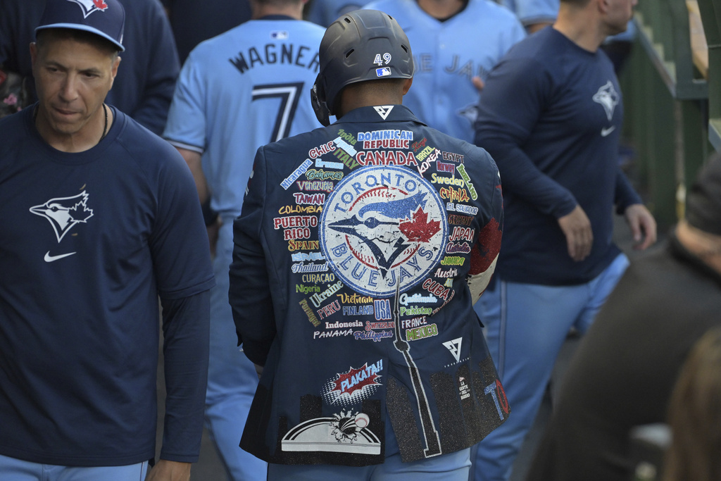Leo Jimenez wears the Blue Jays home run jacket after his first MLB home run, August 2024