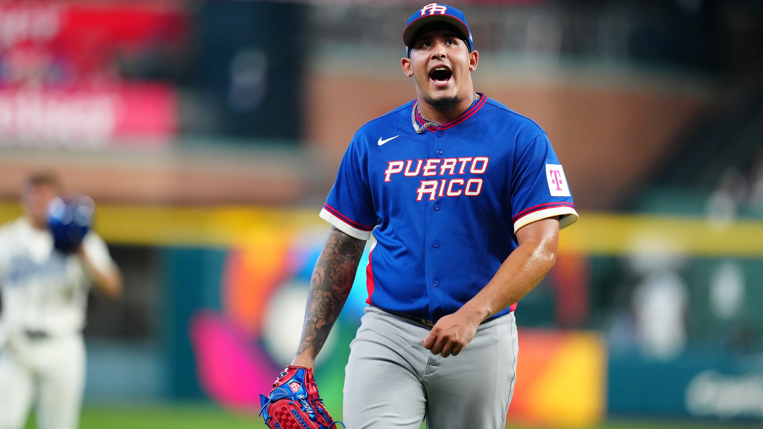Puerto Rico pitcher Eduardo Rivera (99) reacts after striking out Italy's Jac Caglianone with the bases loaded during the second inning of the quarterfinals of the World Baseball Classic, Saturday, March 14, 2026, in Houston. (AP Photo/Karen Warren)